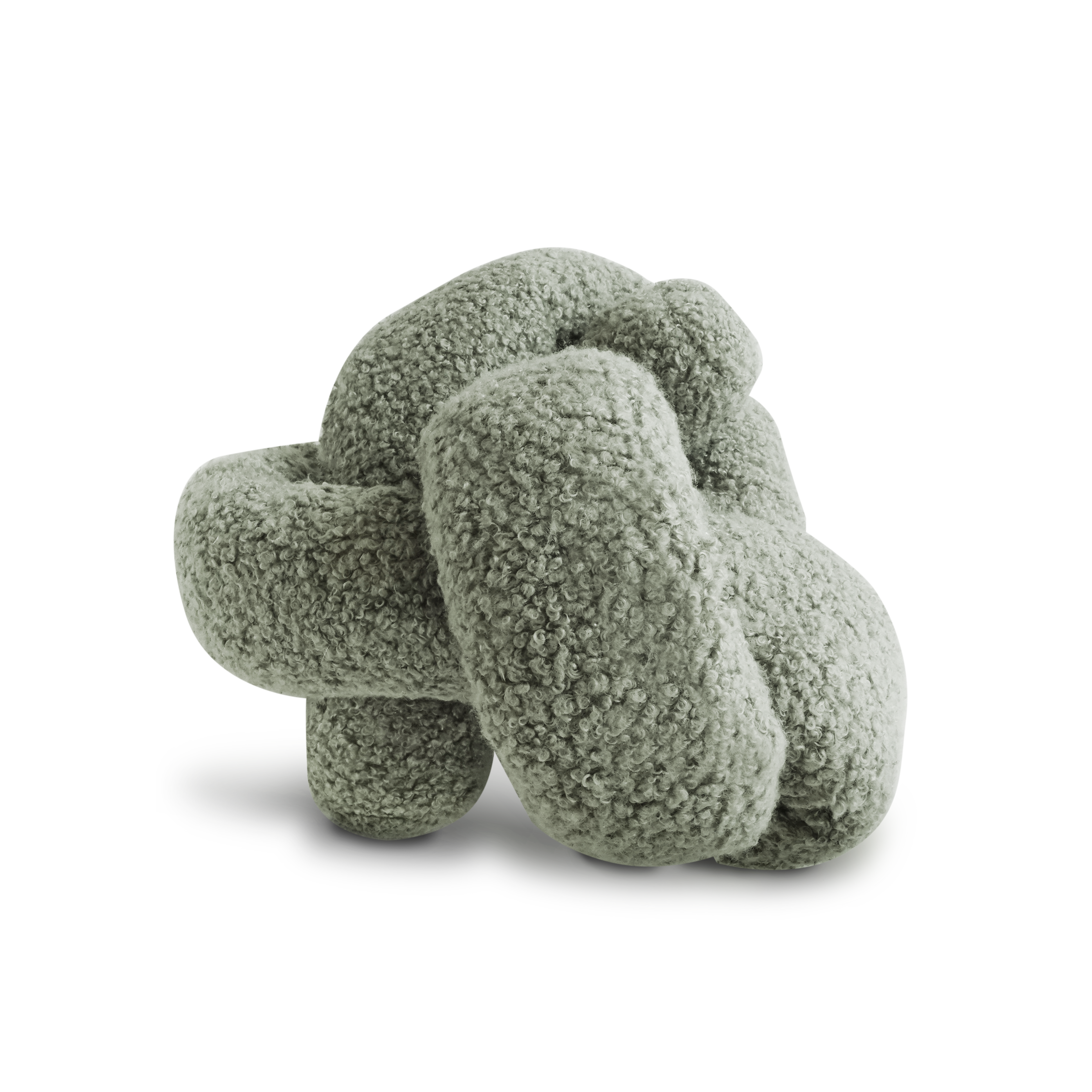 Sage green knotted faux fur pillow rests on a black surface.